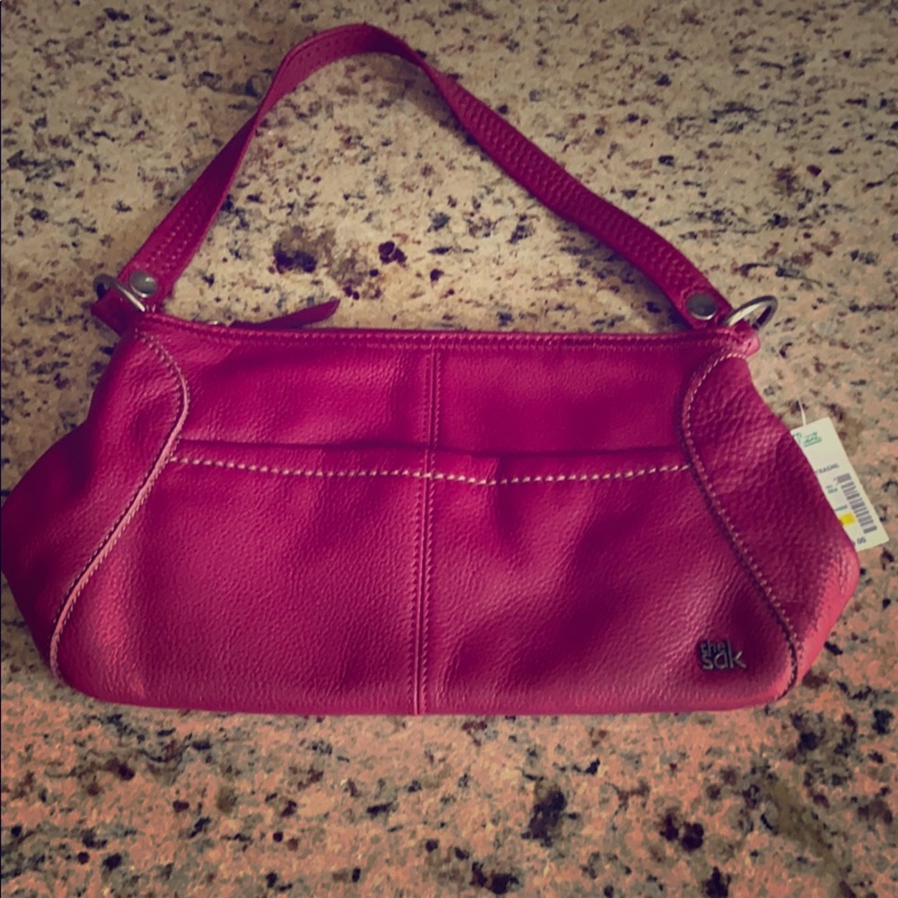 The sak pink 100% leather handbag purse